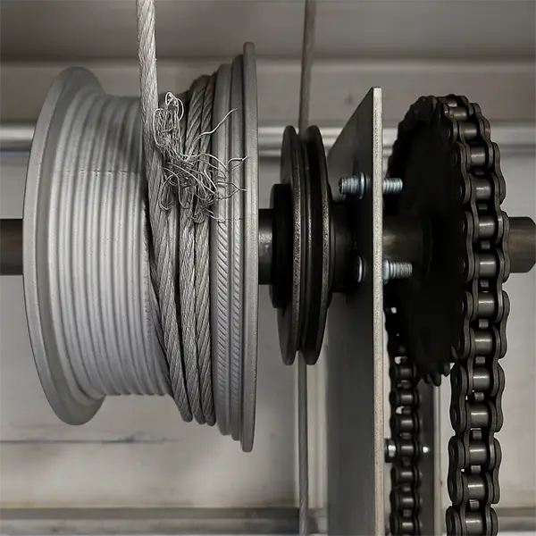 Garage door cable drum and chain mechanism